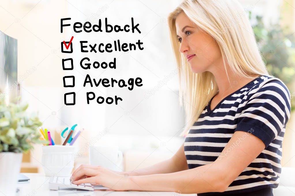 Feedback with happy young woman in front of the computer