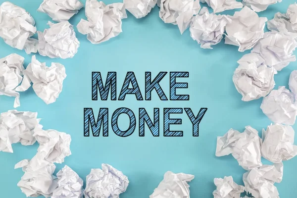 Make Money text with crumpled paper balls