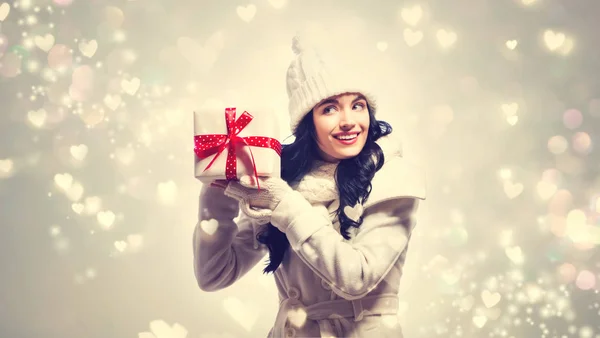 Young woman holding a Christmas gift Stock Image
