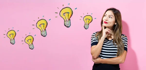 Light Bulbs with young woman — Stock Photo, Image