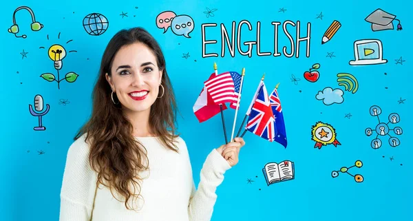Engelse thema met jonge vrouw met vlaggen — Stockfoto