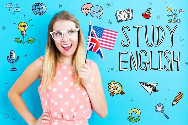 Engelska tema med unga kvinna som håller flaggor — Stockfoto