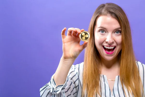 Woman holding a physical ripple coin — Stock Photo, Image
