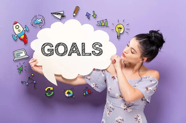 Goals with woman holding a speech bubble — Stock Photo, Image