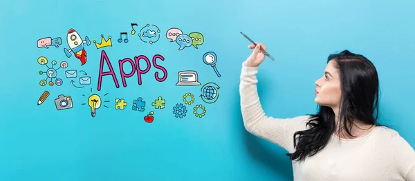 Apps with young woman holding a pen — Stock Photo, Image