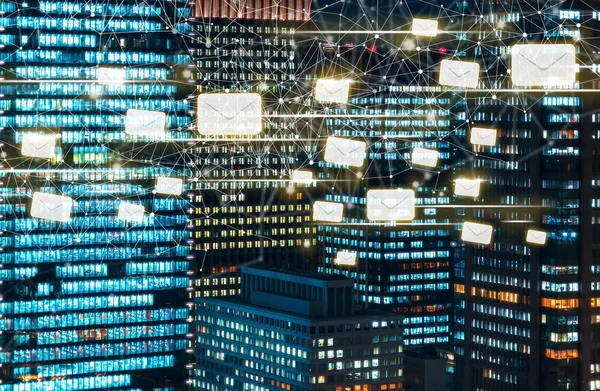 Emails with skyscrapers illuminated at night