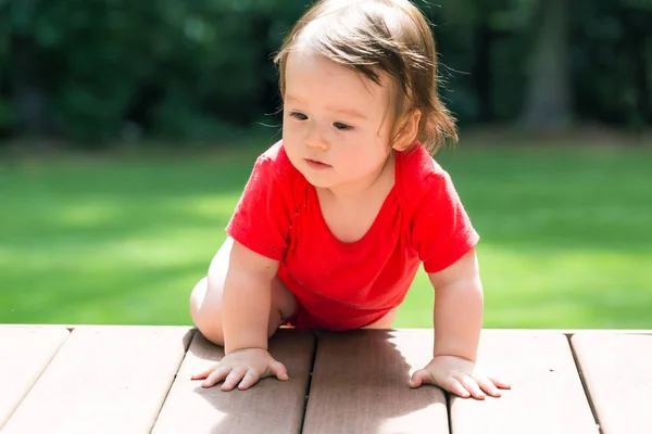 Happy baby boy playing outside — Stock Photo, Image