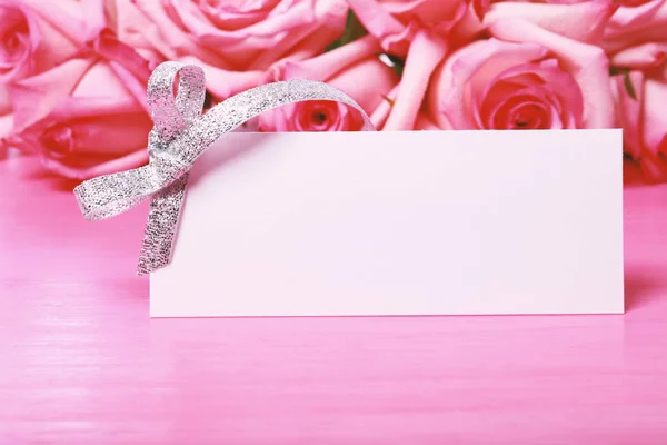 Pink roses with a message card — Stock Photo, Image