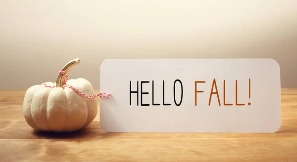 Hello fall message with a small pumpkin — Stock Photo, Image