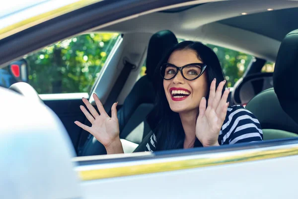 Woman in an autonomous vehicle