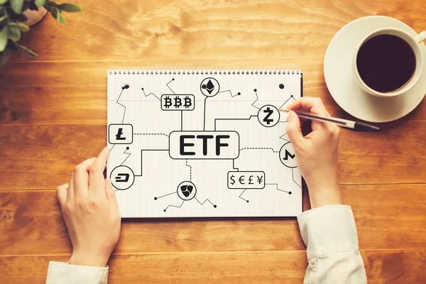Cryptocurrency ETF theme with a person writing in a notebook — Stock Photo, Image