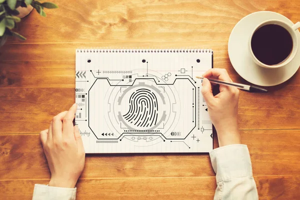 Fingerprint scanning theme with a person writing in a notebook — Stock Photo, Image