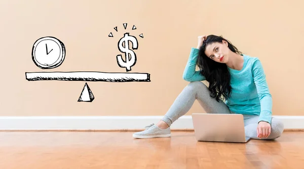 Time and money on the scale with woman using a laptop — Stock Photo, Image