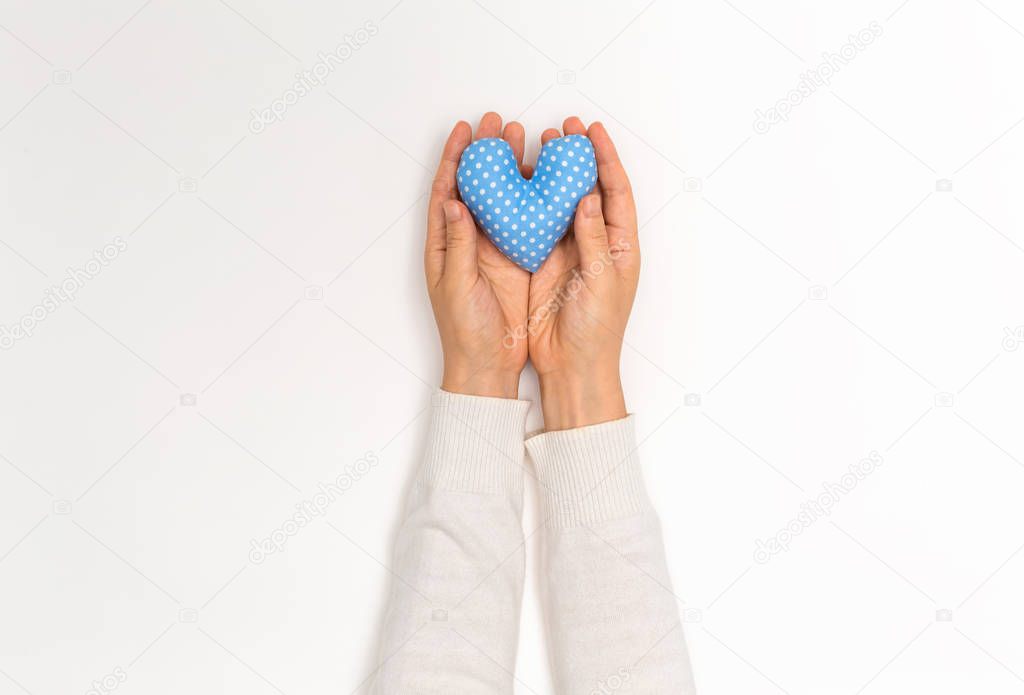Young woman holding a big Valentines day heart