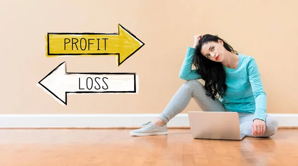 Profit or loss with woman using a laptop — 스톡 사진