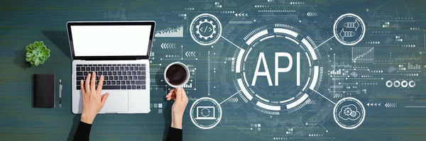 API - application programming interface concept API concept with person using laptop computer — Stockfoto