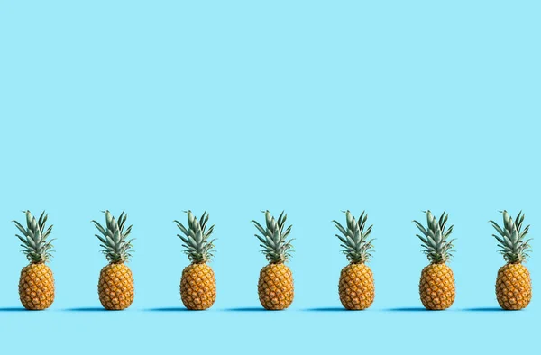 Pineapples on a solid color background — Stock Photo, Image