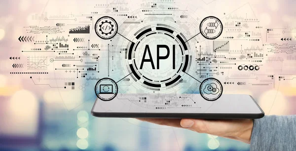 API แนวคิดอินเทอร์เฟซการเขียนโปรแกรมแอปพลิเคชัน แนวคิด API ด้วยคอมพิวเตอร์แท็บเล็ต — ภาพถ่ายสต็อก