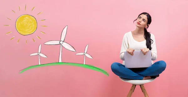 Windmills with woman using a laptop — Stockfoto