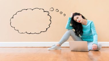 Blank speech bubble with woman using a laptop