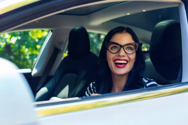 Woman in an autonomous vehicle