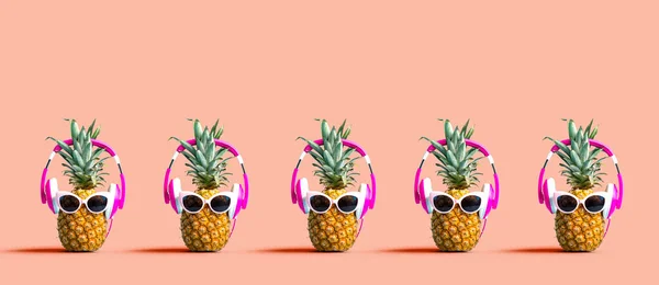 Pineapples wearing headphones — Stock Photo, Image