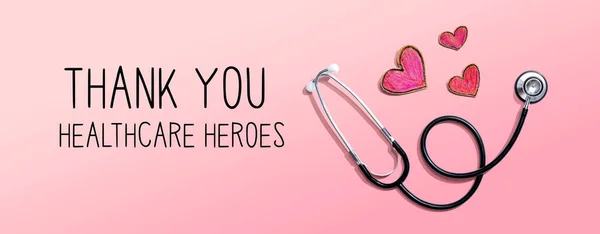 Gracias Healthcare Heroes mensaje con estetoscopio y corazones —  Fotos de Stock