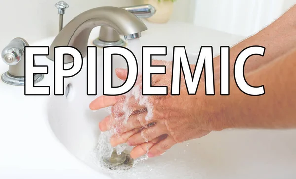 Tema epidemico con una persona che si lava le mani — Foto Stock