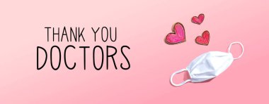 Thank You Doctors message with face mask and heart drawings clipart