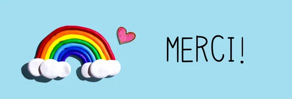 Merci - Thank you in french language with rainbow and heart — Stock Photo, Image