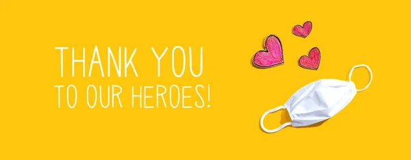 Thank You to Our Heroes message with face mask and heart drawings — Stock Photo, Image