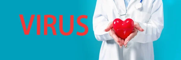 Virus thema met een arts met een hart — Stockfoto