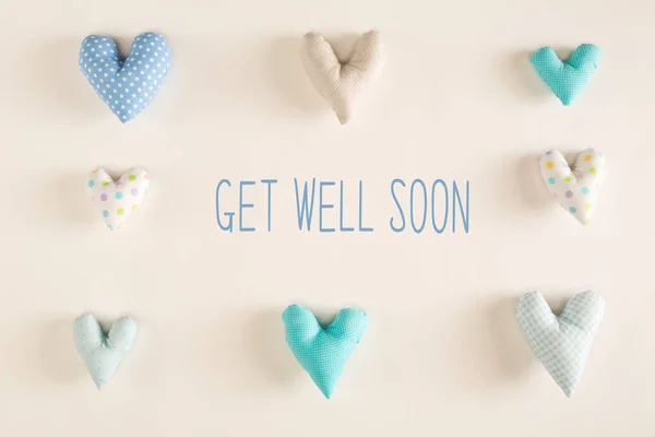 Get well soon message with blue heart cushions