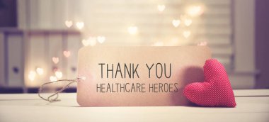 Thank You Healthcare Heroes message with a red heart clipart