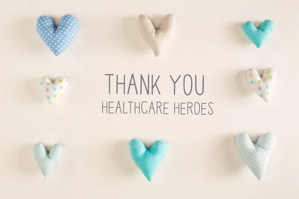 Merci Healthcare Heroes message avec coussins coeur bleu — Photo