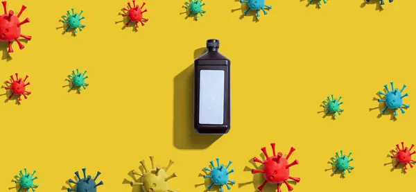 Covid-19 Thema mit einer Flasche Desinfektionsmittel — Stockfoto