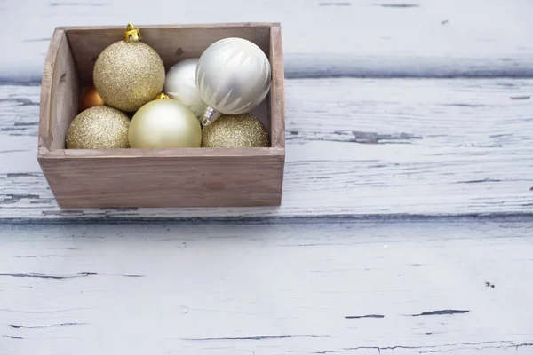 Christmas decoration,  glittering balls in wooden box