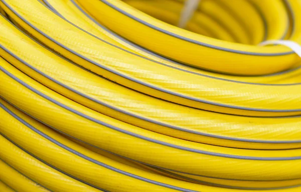 Texture of yellow garden hose