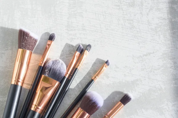 premium makeup brushes on a marble background, creative cosmetics flat lay, tools for make up
