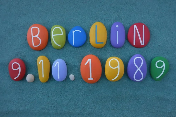 Berlin celebrates the 30th anniversary of the fall of the Wall with a creative composition of carved and colored stone letters over green sand