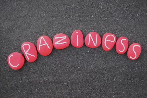 Craziness Λέξη Που Αποτελείται Κόκκινο Χρώμα Και Σκαλιστά Γράμματα Πέτρα — Φωτογραφία Αρχείου