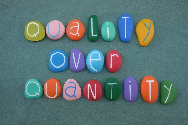 Quality Quantity Conceptual Phrase Composed Multi Colored Stone Letters Green — Stock Photo, Image