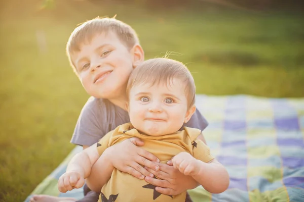 Lovely Brothers Hugging Smiling Lawn — Stock Photo, Image
