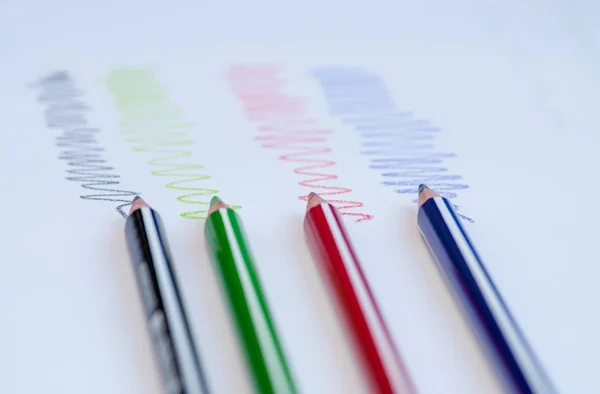 Colour drawing  pencils and colourful curved lines on a white pa — Stock Photo, Image