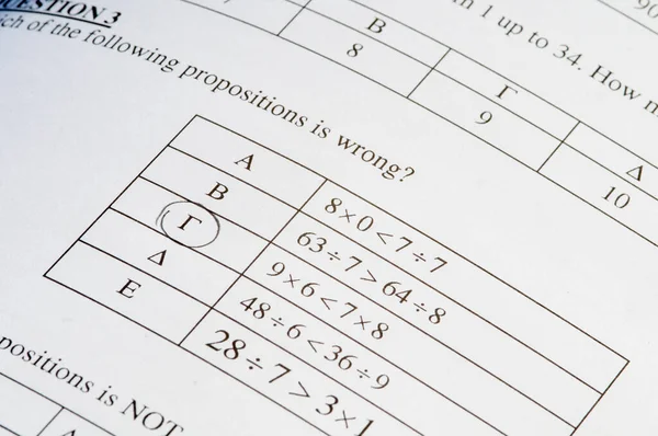Exam paper with mathematics problem solving. — Stock Photo, Image