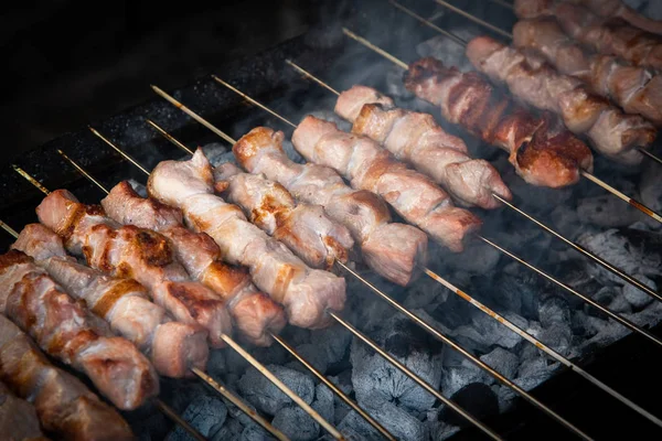 Pork meat kebab, souvlaki, cooked on a charcoal barbecue grill — 스톡 사진