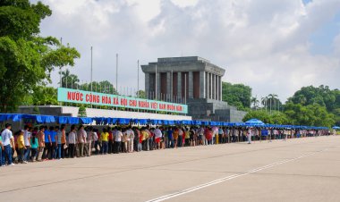  Vietnamese people in a row at the mausoleum of Ho Chi Minh in  