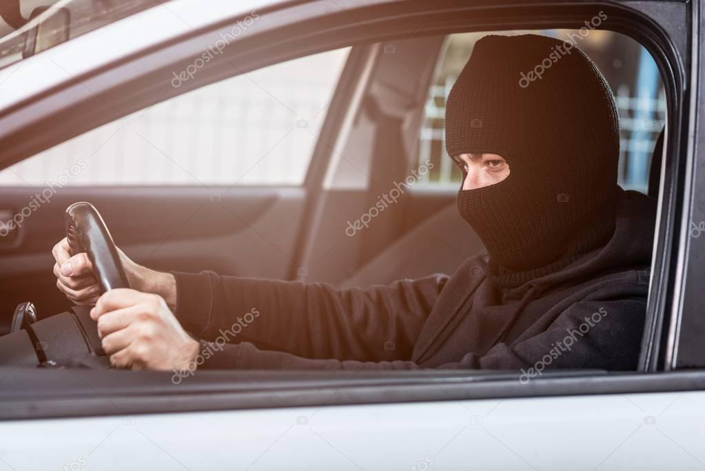 Auto thief driving a stolen car