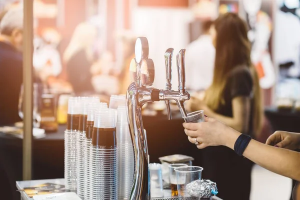 Woman pouring cold beer — Stock Photo, Image