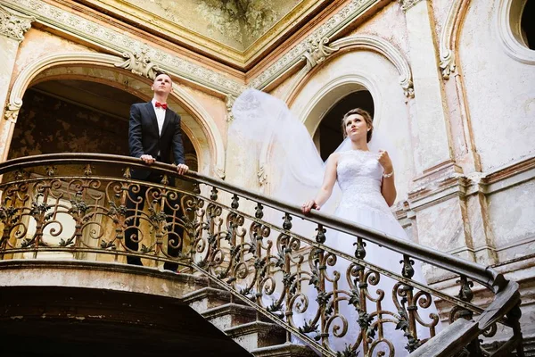 Young beautiful Bride posing on stairs — Stock Photo, Image